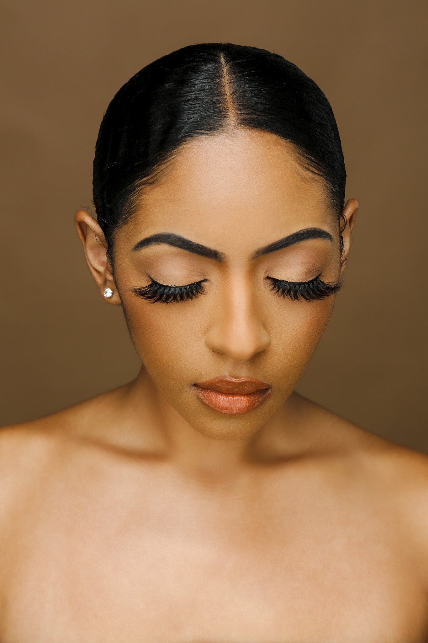Front-view close-up of Boss Lady 3D mink lashes on model, bold wispy volume with flared cat-eye shape for powerful glam.